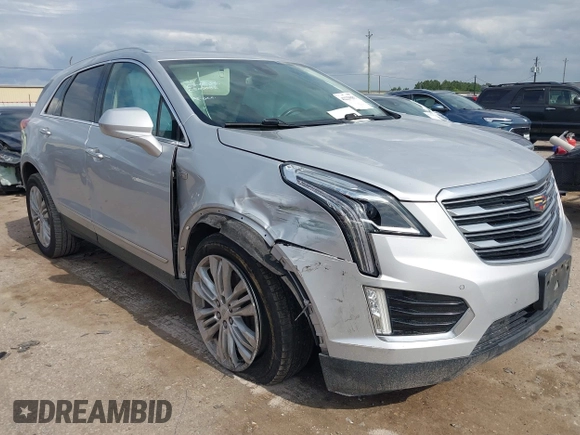 2019 Cadillac XT5 Premium Luxury AWD z VIN 1GYKNFRS0KZ207739, wystawiony jako IAAI lot #42229089 z przebiegiem 99 801 mil mil oraz . Historia ofert i sprzedaży dostępna na DreamBid. Obrazek 1.