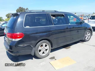 2008 Honda Odyssey Touring with VIN 5FNRL38948B116432, listed as a IAAI auction lot 42162566 with 121,996 mi miles. Bid and sale history available at carsss.com. Image 4.