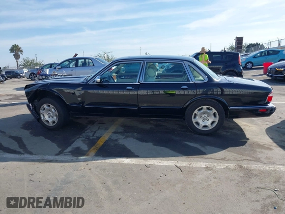 2003 Jaguar XJ 8 with VIN SAJDA14C03LF58706, listed as a IAAI auction lot 41619740 with 95,293 mi miles and . Bid and sale history available at DreamBid. Image 14.