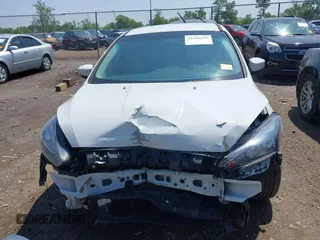 2016 Ford Focus SE with VIN 1FADP3F27GL385739, listed as a IAAI auction lot 42400329 with 114,331 mi miles and . Bid and sale history available at DreamBid. Image 13.
