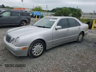 2000 Mercedes-Benz E 320 with VIN WDBJF65J1YB099417, listed as a Copart auction lot 54656915 with 130,387 mi miles and Salvage Title. Bid and sale history available at DreamBid. Image 1.