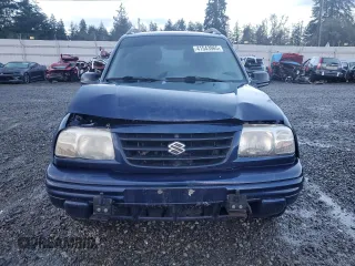 2001 Suzuki Vitara JX z VIN 2S3TD52V916109753, wystawiony jako Copart lot #41543965 z przebiegiem 102 720 mil mil oraz Szkody całkowita. Historia ofert i sprzedaży dostępna na DreamBid. Obrazek 5.