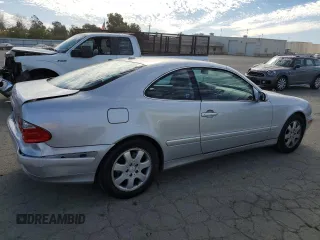2000 Mercedes-Benz CLK 320/430 with VIN WDBLJ65G8YF122308, listed as a Copart auction lot 77449314 with 105,121 mi miles and Salvage Title. Bid and sale history available at DreamBid. Image 3.