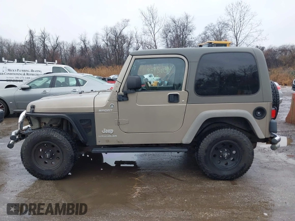 2006 Jeep Wrangler Sport Right Hand Drive with VIN 1J4F449S06P725862, listed as a IAAI auction lot 41562989 with 121,997 mi miles. Bid and sale history available at carsss.com. Image 14.