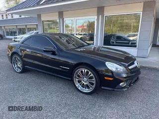 2009 Mercedes-Benz SL 550 z VIN WDBSK71F69F148290, wystawiony jako IAAI lot #42238570 z przebiegiem 161 833 mil mil oraz . Historia ofert i sprzedaży dostępna na DreamBid. Obrazek 1.