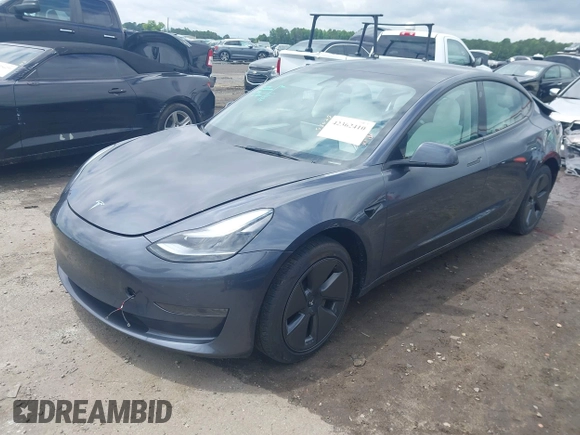 2023 Tesla Model 3 with VIN 5YJ3E1EAXPF628911, listed as a IAAI auction lot 42362410 with 25,387 mi miles and . Bid and sale history available at DreamBid. Image 2.