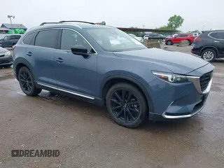 2021 Mazda CX-9 Grand Touring with VIN JM3TCBDY9M0534966, listed as a IAAI auction lot 42166071 with 77,817 mi miles and . Bid and sale history available at DreamBid. Image 1.