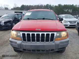 1999 Jeep Grand Cherokee Laredo with VIN 1J4GW58S0XC519908, listed as a IAAI auction lot 41789905 with 221,064 mi miles. Bid and sale history available at carsss.com. Image 13.
