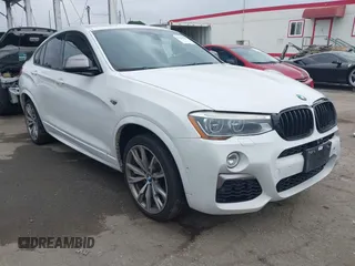 2017 BMW X4 M40i with VIN 5UXXW7C59H0M91384, listed as a IAAI auction lot 41883585 with 163,547 mi miles. Bid and sale history available at carsss.com. Image 1.
