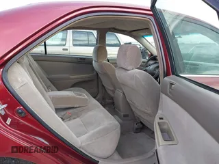 2002 Toyota Camry LE z VIN 4T1BE32K82U005531, wystawiony jako IAAI lot #41650283 z przebiegiem 328 259 mil mil oraz . Historia ofert i sprzedaży dostępna na DreamBid. Obrazek 8.