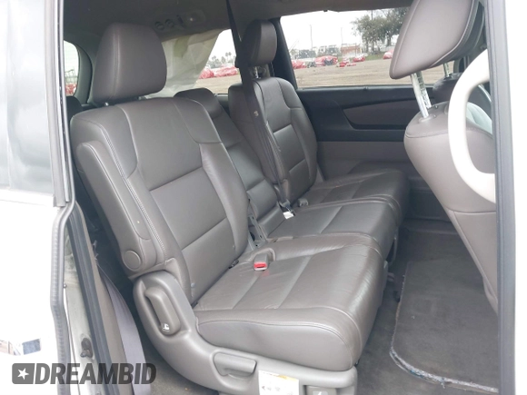 2013 Honda Odyssey Touring with VIN 5FNRL5H99DB041328, listed as a IAAI auction lot 41797520 with 148,523 mi miles and . Bid and sale history available at carsss.com. Image 8.