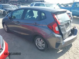 2015 Honda Fit LX with VIN 3HGGK5H52FM771511, listed as a IAAI auction lot 42132749 with 96,666 mi miles and . Bid and sale history available at DreamBid. Image 3.