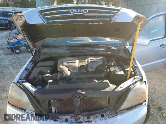 2007 Kia Sorento LX z VIN KNDJD736975696498, wystawiony jako Copart lot #85933984 z przebiegiem 116 434 mil mil oraz Szkoda całkowita • Salvage title. Historia ofert i sprzedaży dostępna na DreamBid. Obrazek 12.