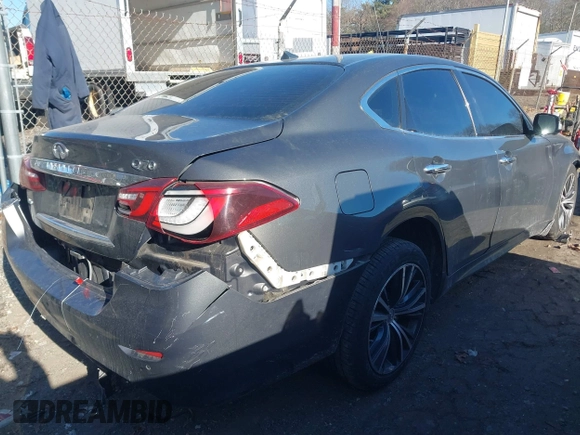 2015 Infiniti Q70 with VIN JN1BY1AR0FM562523, listed as a IAAI auction lot 41310831 with 73,870 mi miles and . Bid and sale history available at DreamBid. Image 4.