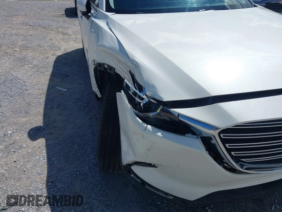 2022 Mazda CX-9 Touring z VIN JM3TCBCY7N0600787, wystawiony jako IAAI lot #42240512 z przebiegiem 27 927 mil mil oraz . Historia ofert i sprzedaży dostępna na DreamBid. Obrazek 6.