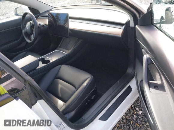 2021 Tesla Model 3 Standard Range Plus z VIN 5YJ3E1EAXMF871730, wystawiony jako IAAI lot #41794274 z przebiegiem 18 791 mil mil oraz . Historia ofert i sprzedaży dostępna na DreamBid. Obrazek 5.