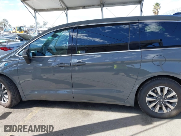 2023 Chrysler Pacifica Hybrid Touring L with VIN 2C4RC1L73PR509853, listed as a IAAI auction lot 41690872 with 83,014 mi miles and . Bid and sale history available at DreamBid. Image 15.