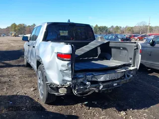 2022 Rivian R1T Adventure Package with VIN 7FCTGAAA1NN012328, listed as a IAAI auction lot 41307929 with 13,588 mi miles. Bid and sale history available at carsss.com. Image 16.
