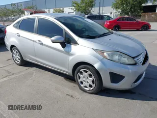 2012 Ford Fiesta SE with VIN 3FADP4BJ2CM150953, listed as a IAAI auction lot 42010904 with 77,637 mi miles. Bid and sale history available at carsss.com. Image 1.