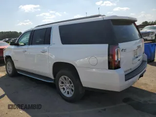 2019 GMC Yukon XL SLT with VIN 1GKS1GKCXKR239712, listed as a Copart auction lot 74721584 with 143,690 mi miles and Salvage Title. Bid and sale history available at carsss.com. Image 2.
