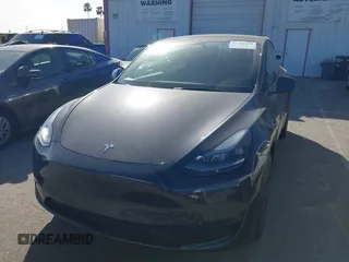 2025 Tesla Model Y Long Range with VIN 7SAYGDED2SF228414, listed as a IAAI auction lot 41706470 with 11,319 mi miles and . Bid and sale history available at DreamBid. Image 19.