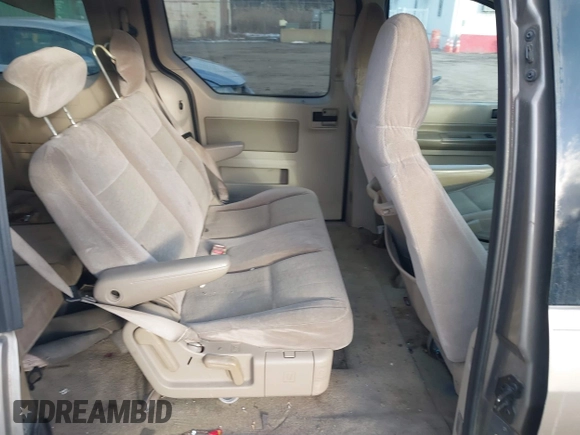 2005 Ford Freestar SE z VIN 2FMZA51645BA05742, wystawiony jako IAAI lot #41429194 z przebiegiem 145 415 mil mil oraz . Historia ofert i sprzedaży dostępna na DreamBid. Obrazek 8.