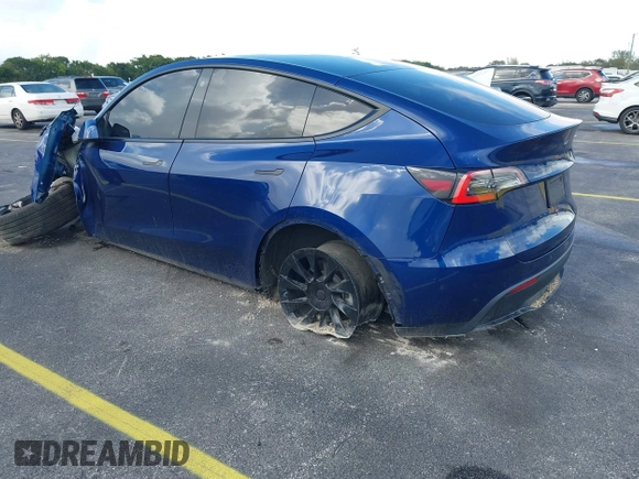 2021 Tesla Model Y Standard Range with VIN 5YJYGDED4MF112857, listed as a IAAI auction lot 41134600 with Not Provided miles and . Bid and sale history available at DreamBid. Image 3.