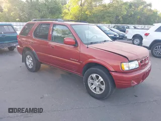 2001 Isuzu Rodeo S z VIN 4S2CK58W414308980, wystawiony jako IAAI lot #42496432 z przebiegiem 166 360 mil mil oraz . Historia ofert i sprzedaży dostępna na DreamBid. Obrazek 1.