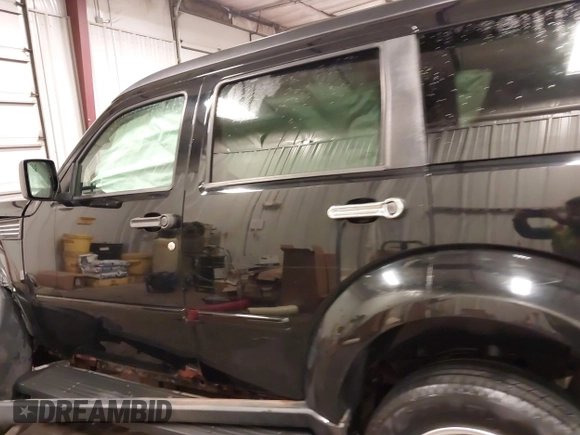 2007 Dodge Nitro SXT with VIN 1D8GU28K67W663621, listed as a IAAI auction lot 41691529 with 211,556 mi miles. Bid and sale history available at carsss.com. Image 15.
