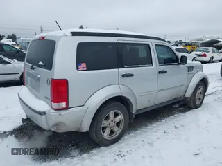 2007 Dodge Nitro SLT with VIN 1D8GU58K07W734541, listed as a IAAI auction lot 41556413 with 221,119 mi miles. Bid and sale history available at carsss.com. Image 4.