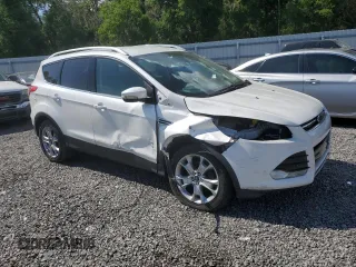 2016 Ford Escape Titanium with VIN 1FMCU0JX8GUC35838, listed as a Copart auction lot 51061285 with 84,224 mi miles and Salvage Title. Bid and sale history available at carsss.com. Image 4.