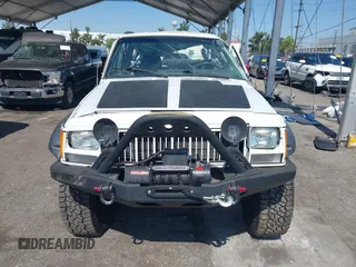 1991 Jeep Cherokee Country z VIN 1J4FJ78S7ML632675, wystawiony jako IAAI lot #42283175 z przebiegiem 116 062 mil mil oraz . Historia ofert i sprzedaży dostępna na DreamBid. Obrazek 12.