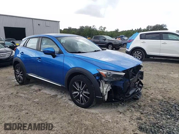 2016 Mazda CX-3 Grand Touring with VIN JM1DKBD72G0106104, listed as a Copart auction lot 52581085 with 76,603 mi miles and Salvage Title. Bid and sale history available at carsss.com. Image 15.