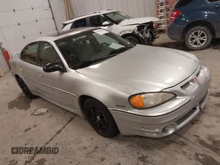 2004 Pontiac Grand Am GT with VIN 1G2NW52E04M617802, listed as a IAAI auction lot 41353209 with 103,716 mi miles. Bid and sale history available at carsss.com. Image 1.