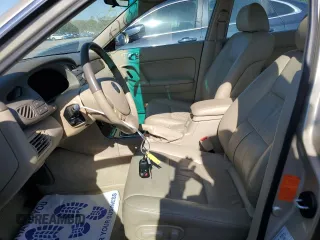 2001 Mazda Millenia z VIN JM1TA221911716600, wystawiony jako Copart lot #57639185 z przebiegiem 86 947 mil mil oraz Tytuł czysty. Historia ofert i sprzedaży dostępna na DreamBid. Obrazek 7.