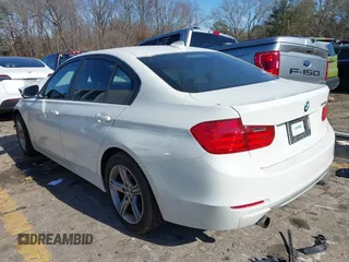 2013 BMW 3 Series 320i with VIN WBA3B1C56DF462549, listed as a IAAI auction lot 41411287 with 119,146 mi miles. Bid and sale history available at carsss.com. Image 3.