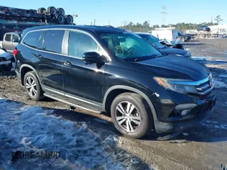 2017 Honda Pilot EX-L with VIN 5FNYF5H54HB046572, listed as a IAAI auction lot 41332431 with 134,661 mi miles. Bid and sale history available at carsss.com. Image 1.