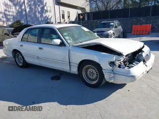 1997 Mercury Grand Marquis LS z VIN 2MELM75W5VX643961, wystawiony jako IAAI lot #40815999 z przebiegiem 48 005 mil mil oraz . Historia ofert i sprzedaży dostępna na DreamBid. Obrazek 1.