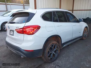 2018 BMW X1 xDrive28i with VIN WBXHT3C32J5K29627, listed as a IAAI auction lot 40995212 with 64,162 mi miles. Bid and sale history available at carsss.com. Image 4.