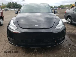 2022 Tesla Model Y Long Range z VIN 7SAYGDEEXNA008898, wystawiony jako Copart lot #54915445 z przebiegiem 35 467 mil mil oraz Szkoda całkowita • Salvage title. Historia ofert i sprzedaży dostępna na DreamBid. Obrazek 5.