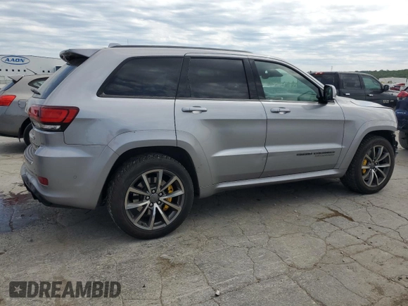 2018 Jeep Grand Cherokee Trackhawk with VIN 1C4RJFN91JC223825, listed as a Copart auction lot 58011465 with 83,177 mi miles and Salvage title. Bid and sale history available at DreamBid. Image 3.