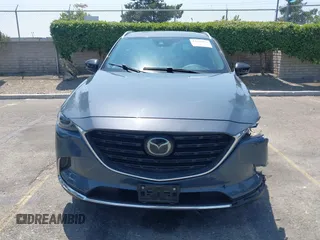 2022 Mazda CX-9 Grand Touring with VIN JM3TCBDY1N0611766, listed as a IAAI auction lot 42452059 with 60,755 mi miles and . Bid and sale history available at DreamBid. Image 12.