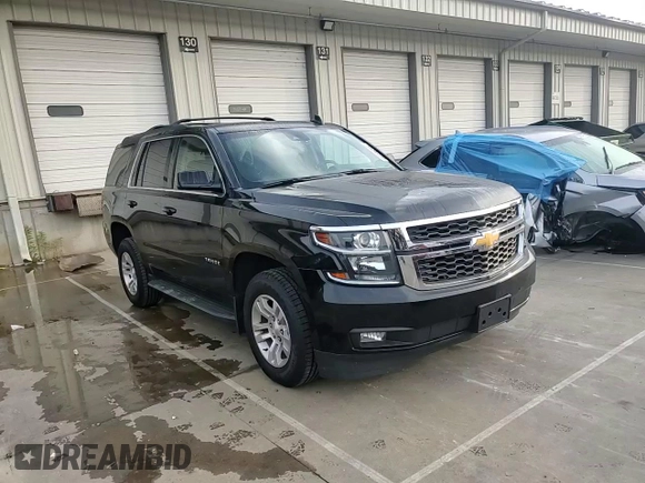 2019 Chevrolet Tahoe LT with VIN 1GNSKBKC2KR349527, listed as a Copart auction lot 58496695 with 128,590 mi miles and Salvage title. Bid and sale history available at DreamBid. Image 14.