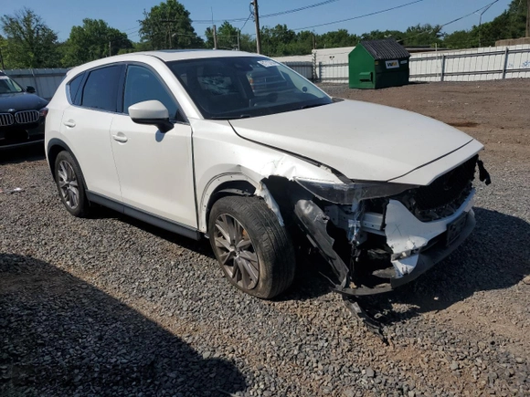 2019 Mazda CX-5 Grand Touring with VIN JM3KFBDM2K1663140, listed as a Copart auction lot 61713755 with 68,101 mi miles and Salvage title. Bid and sale history available at DreamBid. Image 4.
