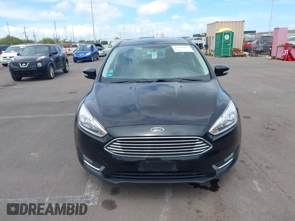 2017 Ford Focus Titanium z VIN 1FADP3N24HL326330, wystawiony jako IAAI lot #42594927 z przebiegiem 54 727 mil mil oraz . Historia ofert i sprzedaży dostępna na DreamBid. Obrazek 12.