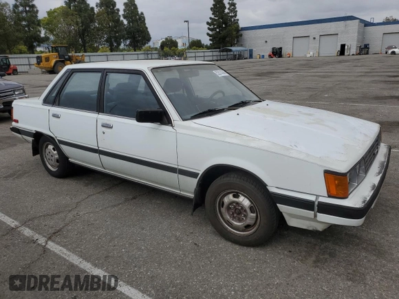 1984 Toyota Camry z VIN JT2SV16E3E0220882, wystawiony jako Copart lot #53514345 z przebiegiem 112 430 mil mil oraz Czysty tytuł • Clean title. Historia ofert i sprzedaży dostępna na DreamBid. Obrazek 4.