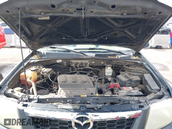 2008 Mazda Tribute ES with VIN 4F2CZ06188KM01024, listed as a IAAI auction lot 41890148 with 122,367 mi miles. Bid and sale history available at carsss.com. Image 10.