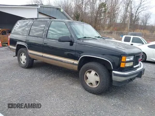 1999 GMC Yukon with VIN 1GKEK13R9XJ807786, listed as a IAAI auction lot 41478109 with 193,748 mi miles. Bid and sale history available at carsss.com. Image 1.