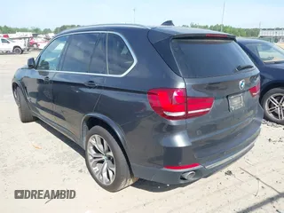 2014 BMW X5 xDrive35d with VIN 5UXKS4C57E0J93982, listed as a IAAI auction lot 42085173 with 169,908 mi miles. Bid and sale history available at carsss.com. Image 3.