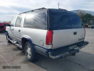 1997 Chevrolet Suburban with VIN 1GNFK16R2VJ365448, listed as a IAAI auction lot 41689906 with 228,151 mi miles. Bid and sale history available at carsss.com. Image 3.